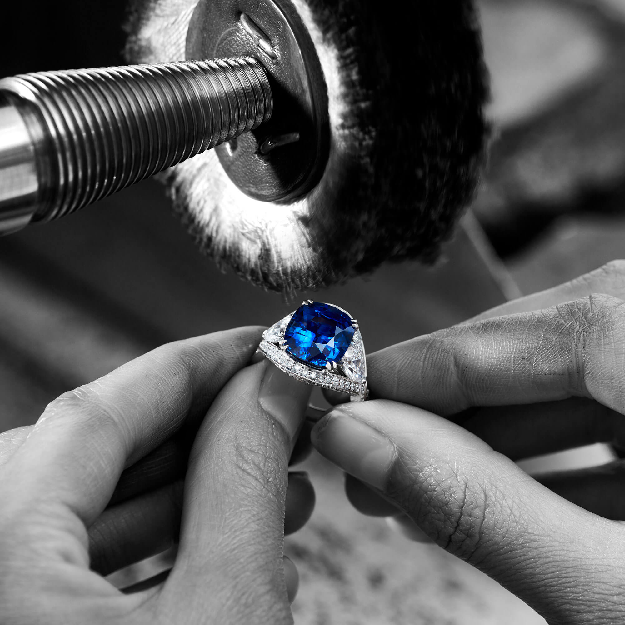 a craftsman repairing a Garrard Jewelled Vault Sapphire and diamond ringin the workshop