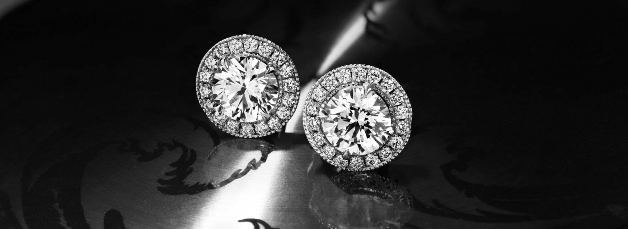 Close up of a pair of Garrard Classic jewellery collection Diamond earrings desktop
