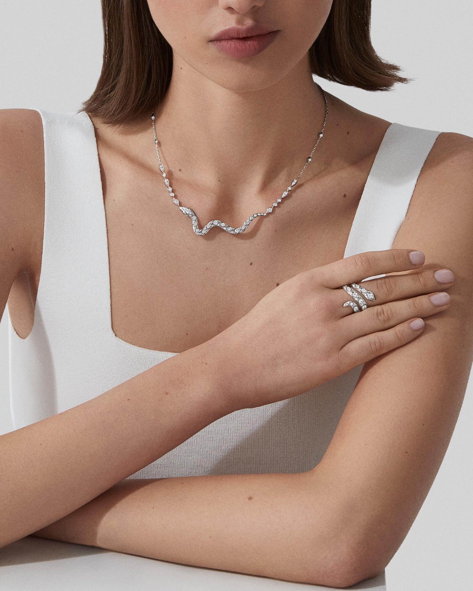 Garrard Muse Jewellery collection diamond necklance and ring on model