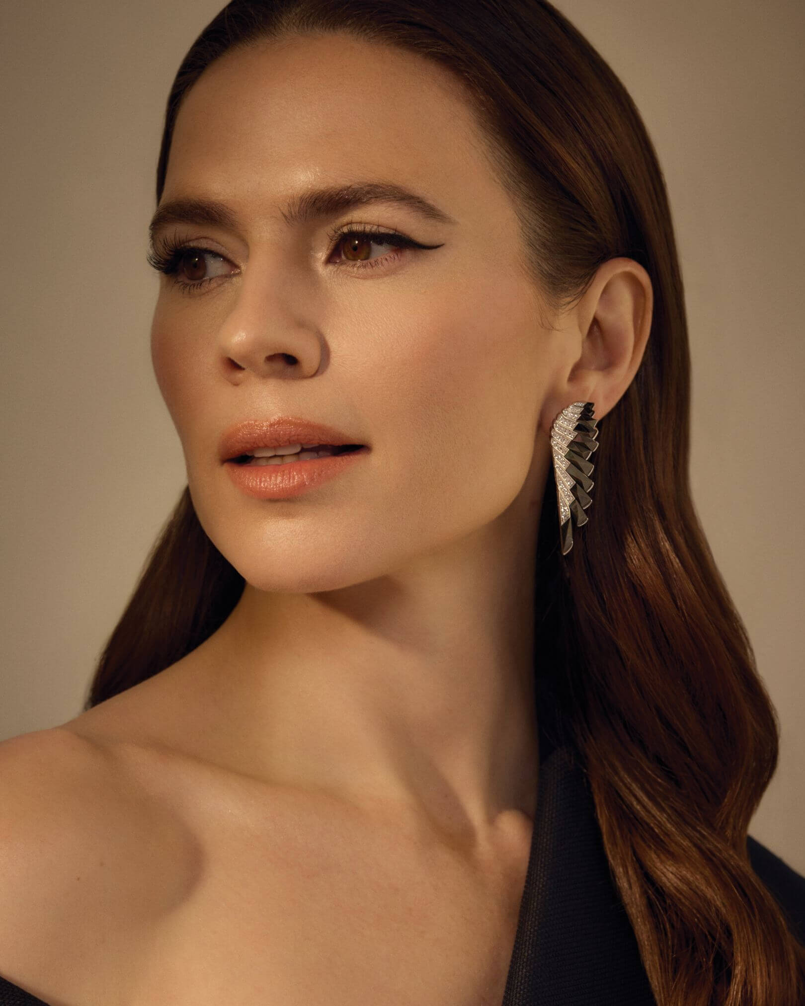 Hayley Atwell graces the cover of The Glossary Magazine's latest CREATIVES Issue, wearing Garrard's striking jewellery Wings Rising