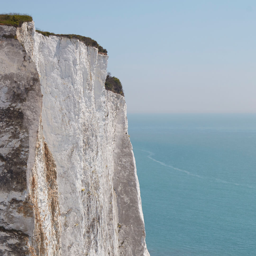 Image of the sea and white clives to showcase Garrard Sustainability