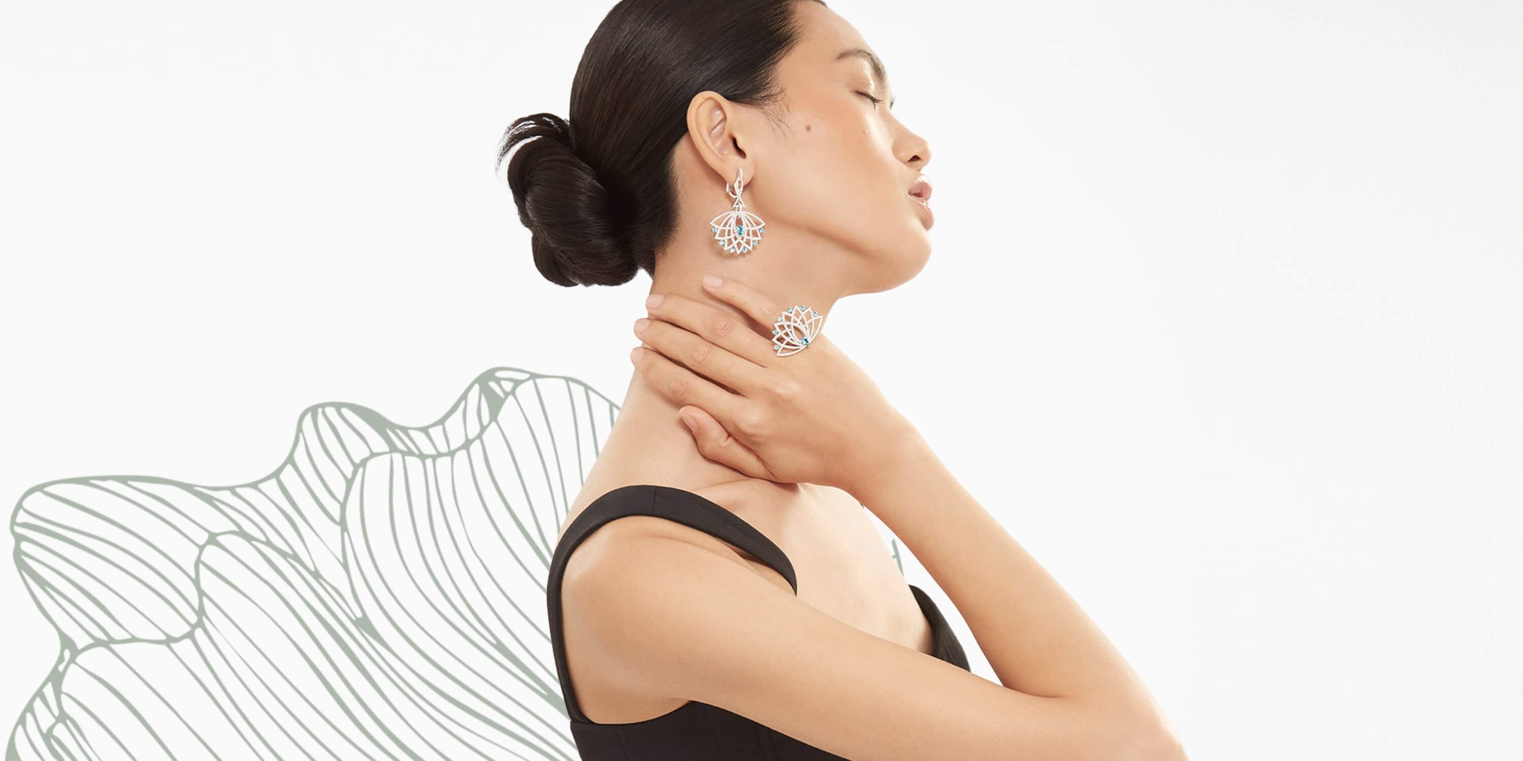 Model wears Garrard Bloom Aquamarine and diamond jewellery campaign desktop