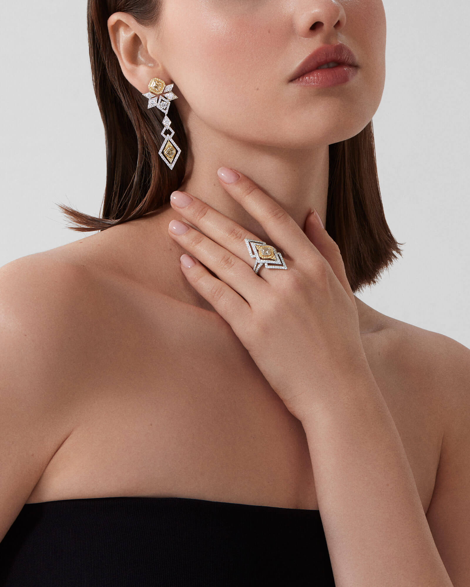 Model wears Garrard high jewellery collection Cosmo High Jewellery Suite ring and earrings