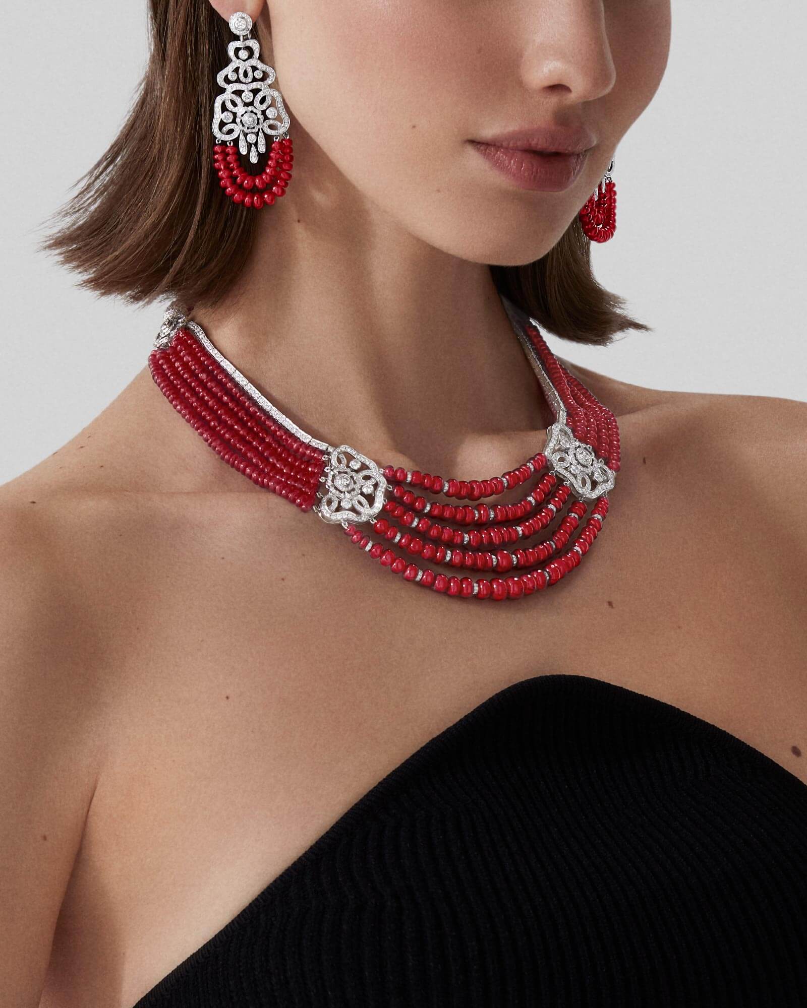 Model wears Garrard high jewellery collection Red Rose High Jewellery Suite 2023 closeup