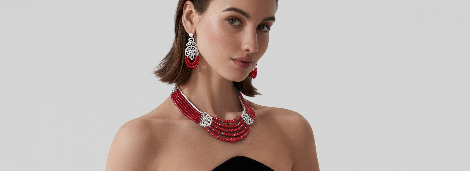Model wears Garrard high jewellery collection Red Rose High Jewellery Suite desktop 2023