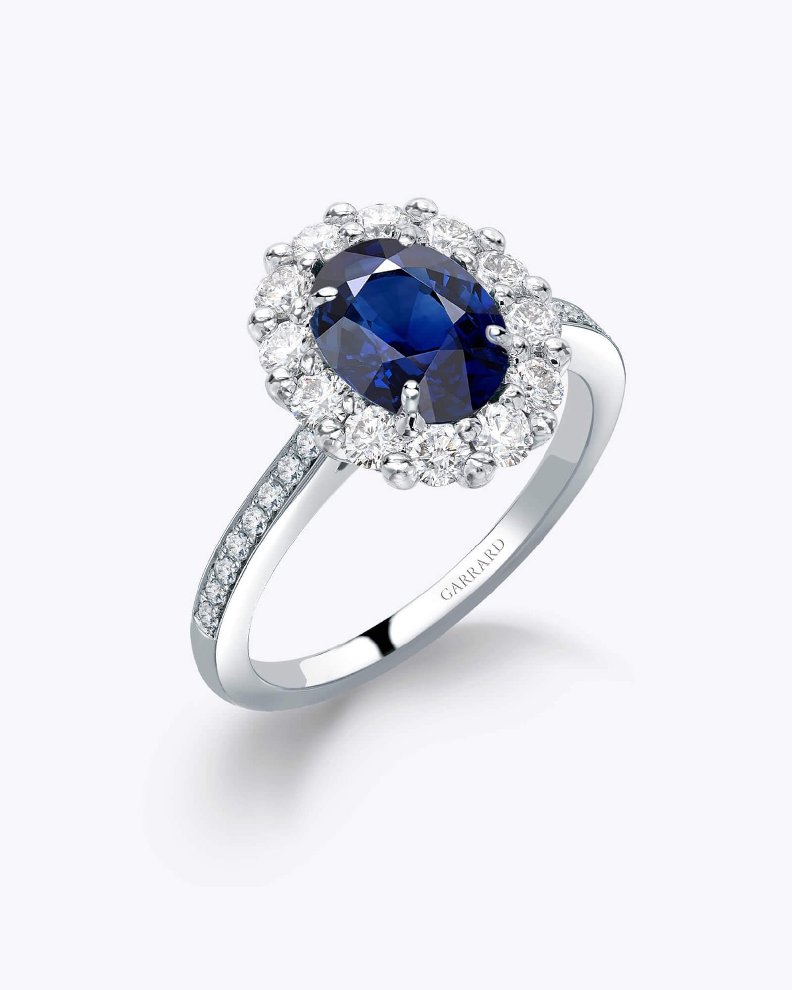 The Garrard 1735 Oval Cut sapphire and Diamond Cluster Engagement Ring 1